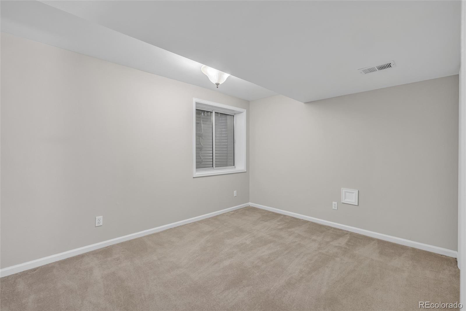 9390 Yale Lane Highlands Ranch, CO 80130 - Photo 40 of 50 a view of an empty room with a window