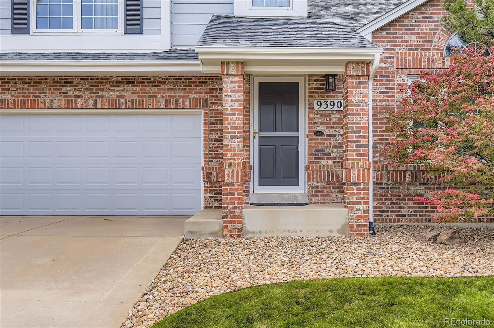 9390 Yale Lane Highlands Ranch, CO 80130 - Photo 4 of 50 a front view of a house with a yard