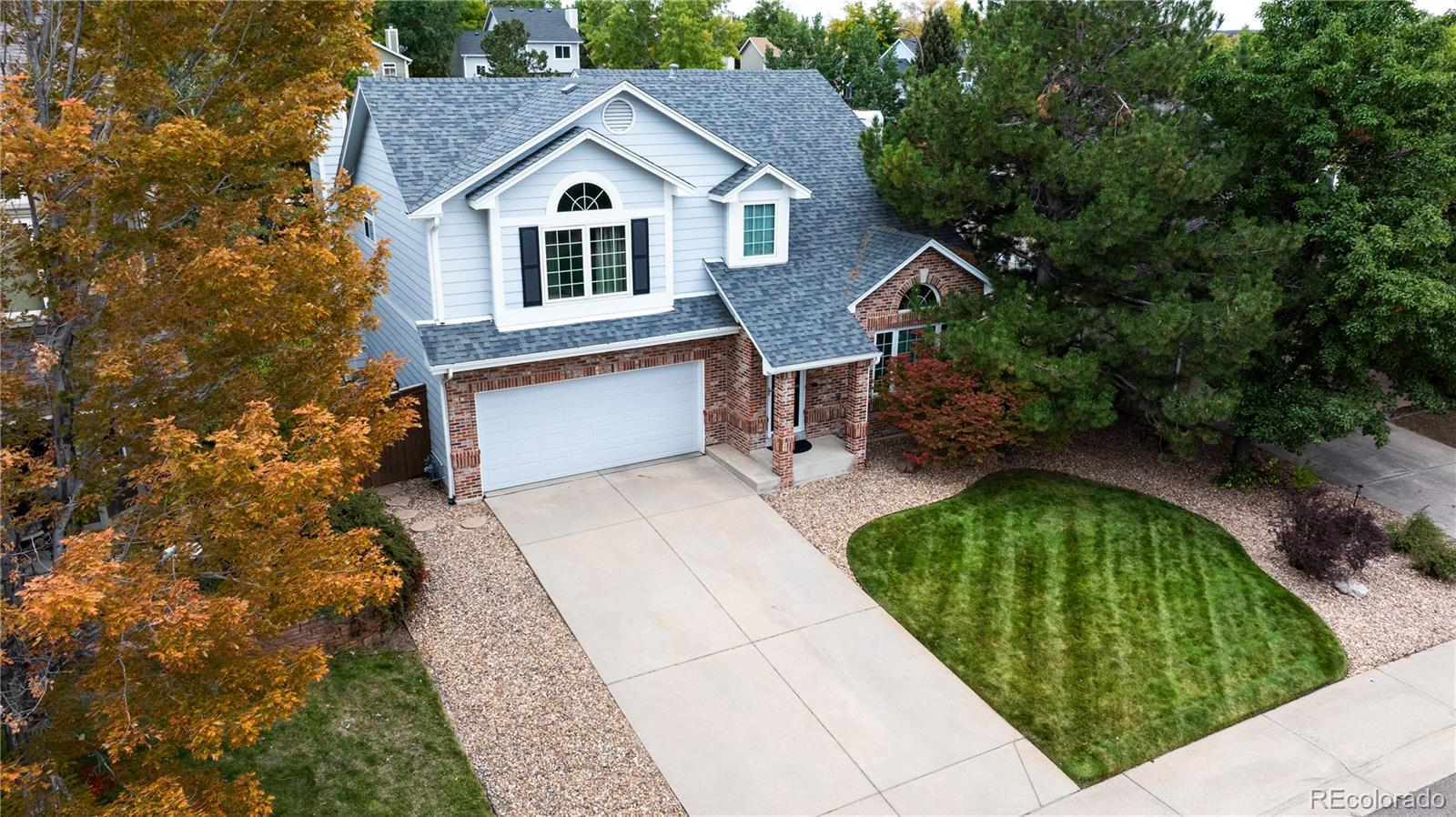 9390 Yale Lane Highlands Ranch, CO 80130 - Photo 44 of 50 a front view of a house with a yard