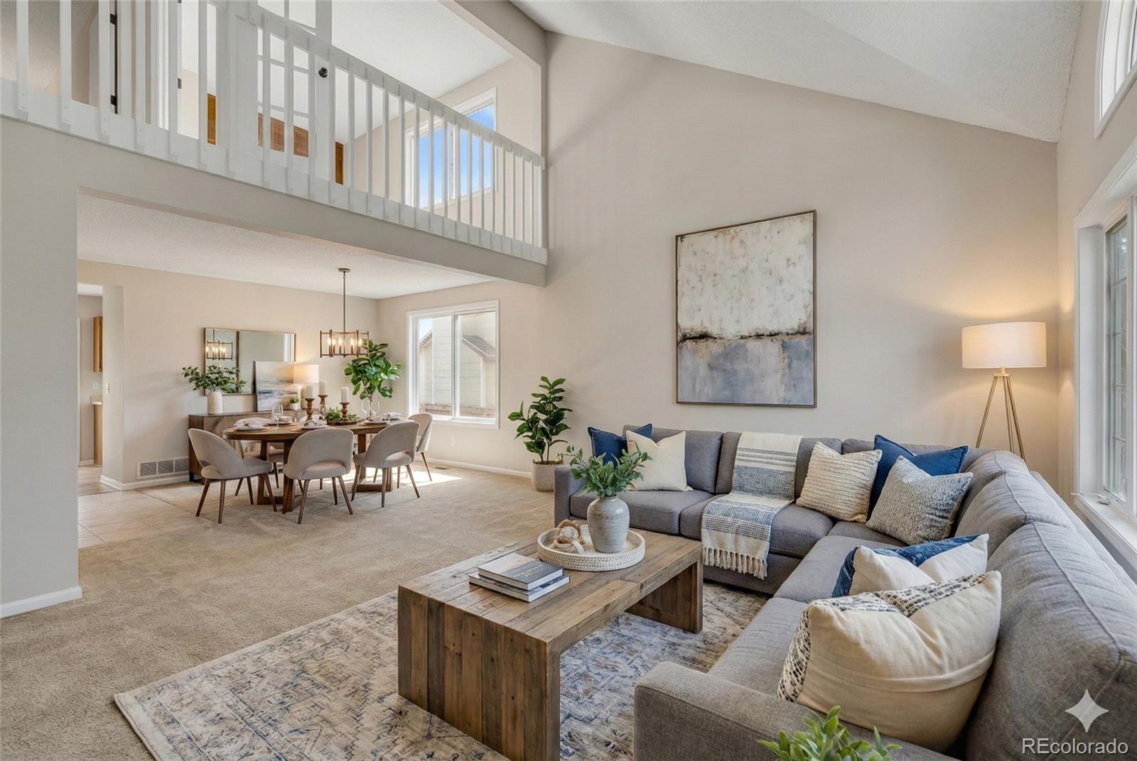 9390 Yale Lane Highlands Ranch, CO 80130 - Photo 5 of 50 a living room with furniture potted plant and a rug