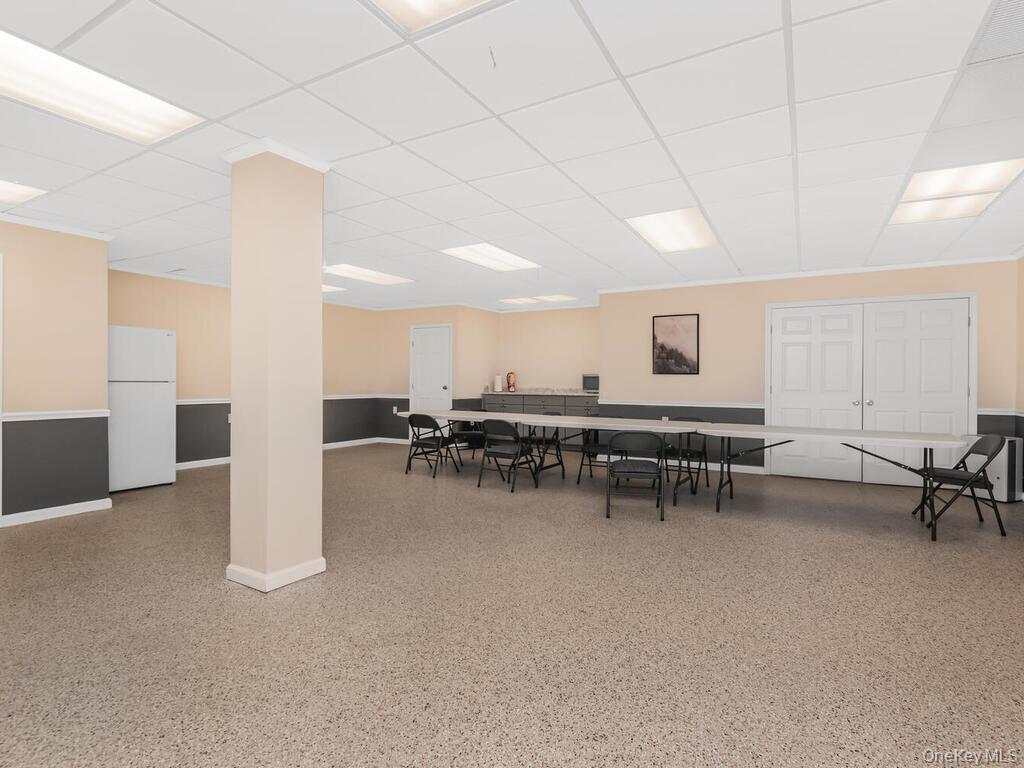 60 White Oak Street, Unit 2H New Rochelle, NY 10801 - Photo 13 of 15 a room with furniture and a table