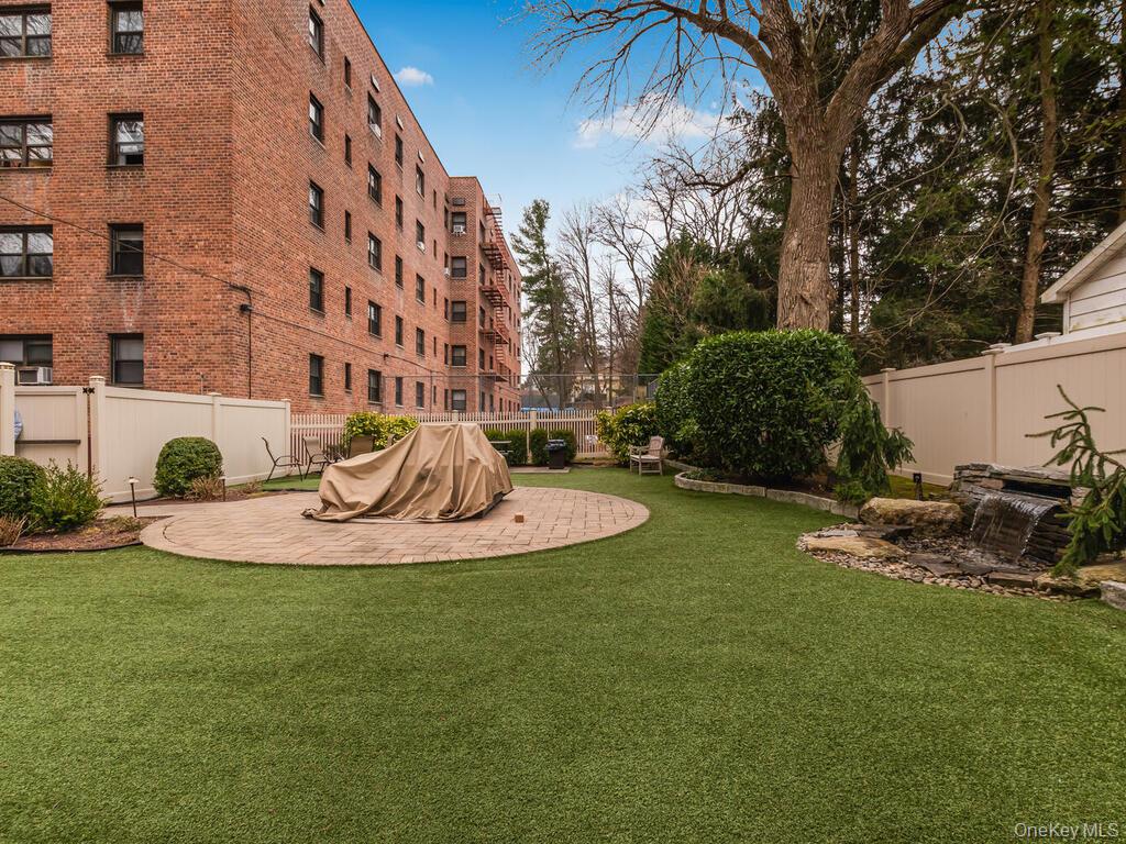60 White Oak Street, Unit 2H New Rochelle, NY 10801 - Photo 15 of 15 a view of a backyard with plants and outdoor seating