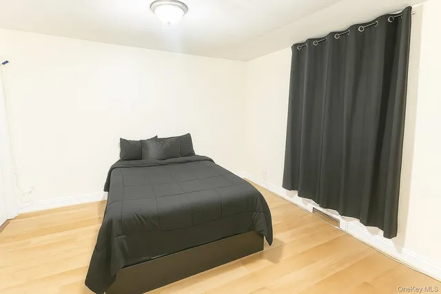 a bedroom with a bed and a cabinets