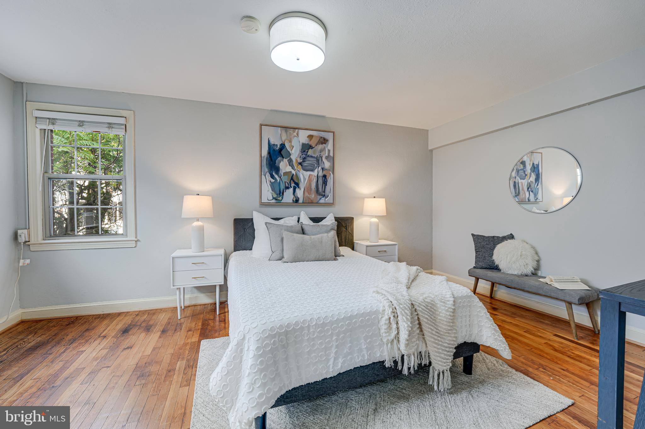1441 Euclid Street Northwest, Unit 301 Washington, DC 20009 - Photo 15 of 18 a bedroom with bed and a window