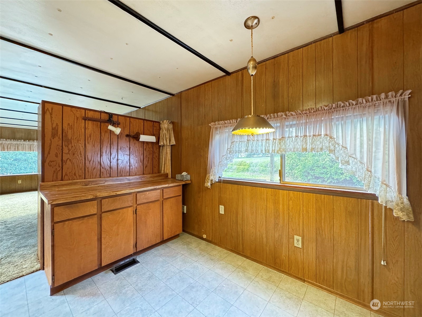 183 Spath Road Sequim, WA 98382 - Photo 18 of 40 a kitchen with stainless steel appliances wooden cabinets a stove and a refrigerator