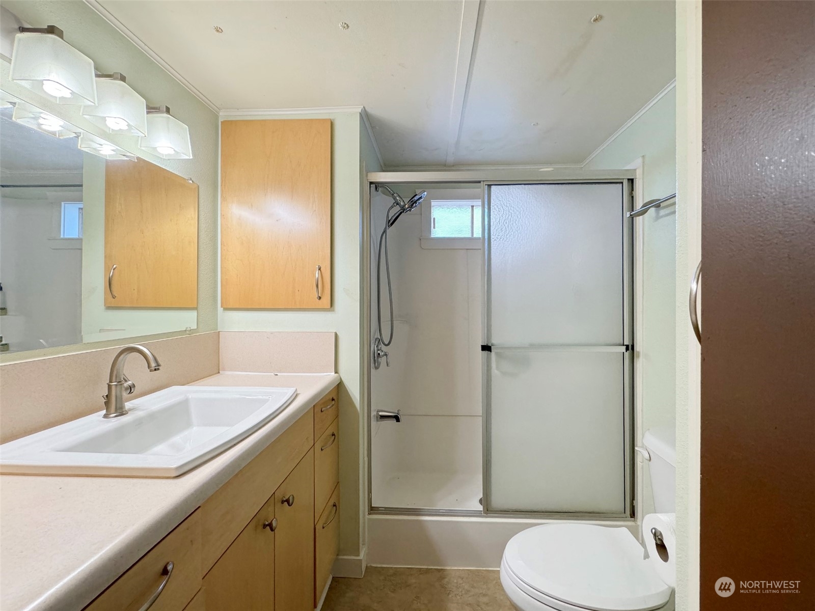 183 Spath Road Sequim, WA 98382 - Photo 19 of 40 a bathroom with a toilet sink shower and mirror
