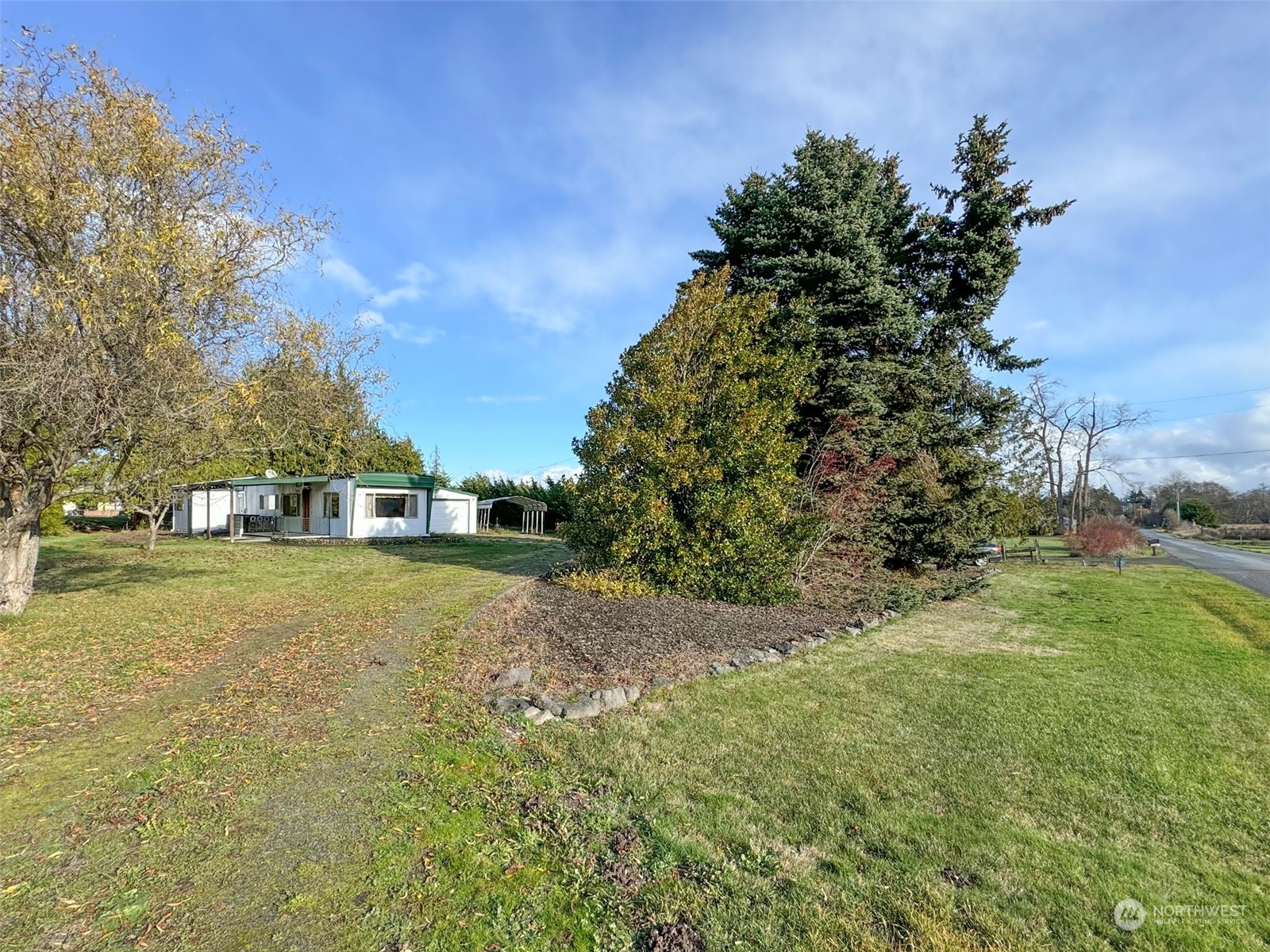 183 Spath Road Sequim, WA 98382 - Photo 36 of 40 a view of a yard with a house