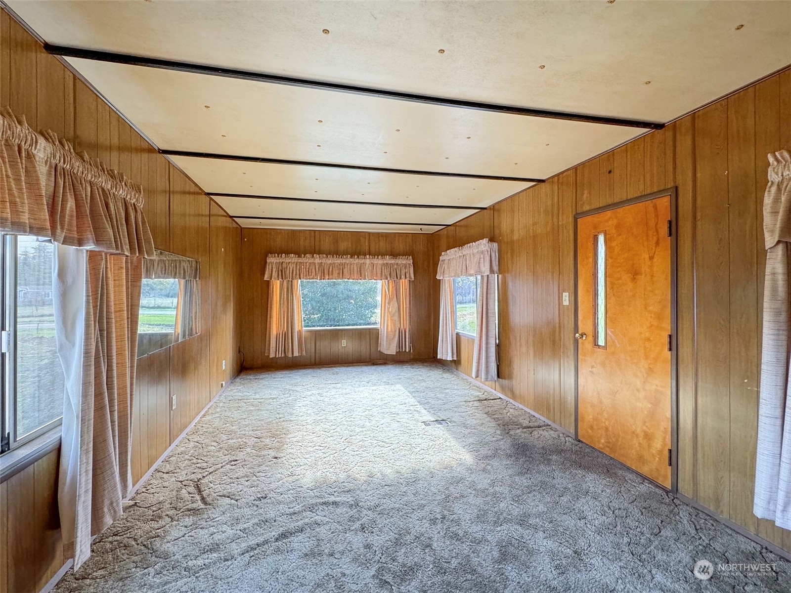 183 Spath Road Sequim, WA 98382 - Photo 10 of 40 a view of a hallway with wooden shelves