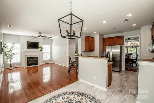 a view of a kitchen with furniture and a fireplace