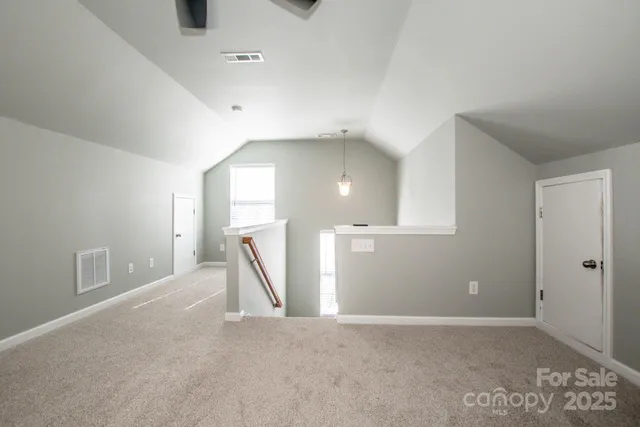 a view of a livingroom with a staircase
