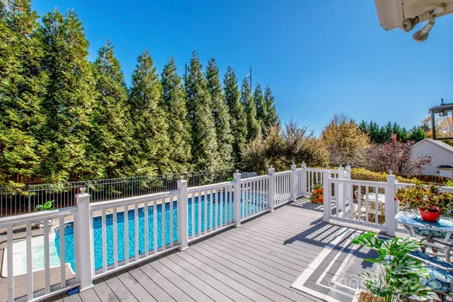 a view of a two chairs on deck with wooden floor