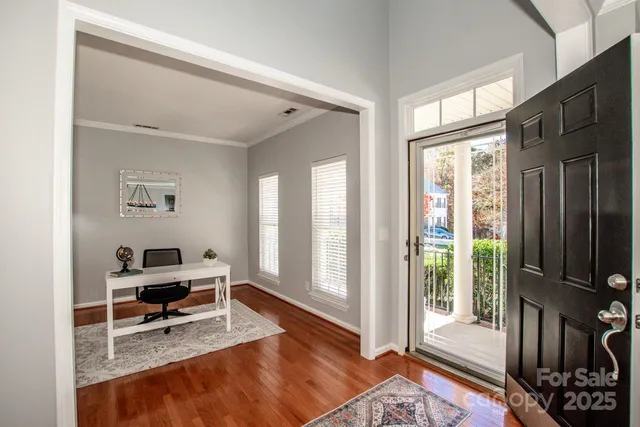 a living room with furniture rug and window