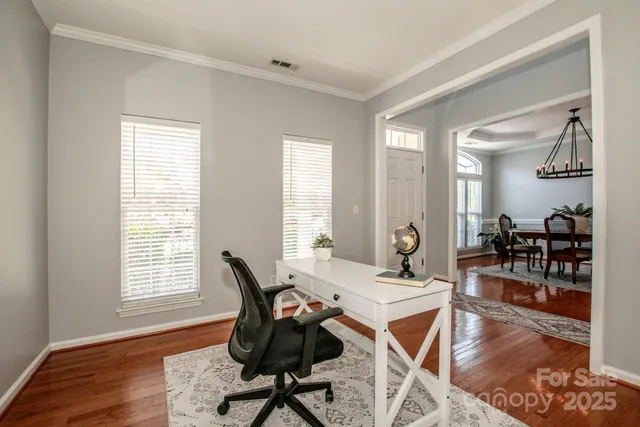 a work room with furniture and wooden floor