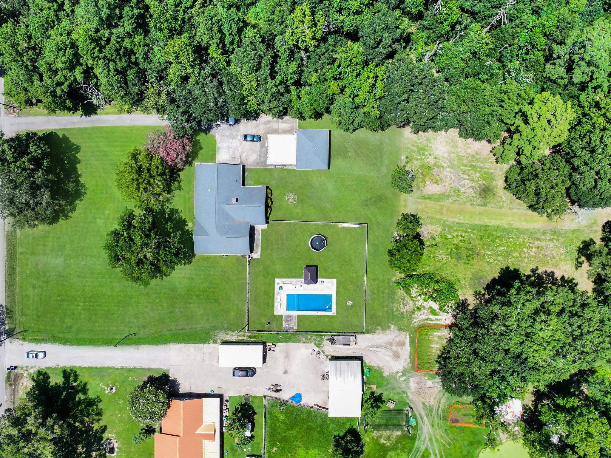 2641 Oilla Road Orange, TX 77630 - Photo 4 of 50 an aerial view of a house with a yard