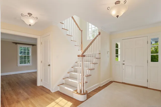 a view of entryway with wooden floor