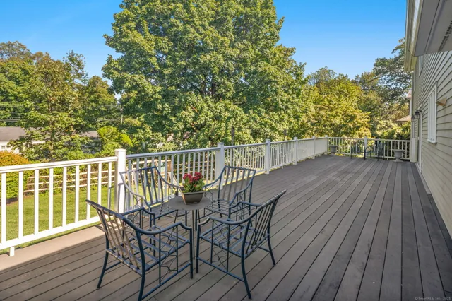 a view of a wooden deck with furniture