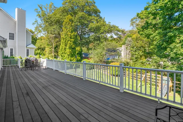 a view of a balcony with wooden floor