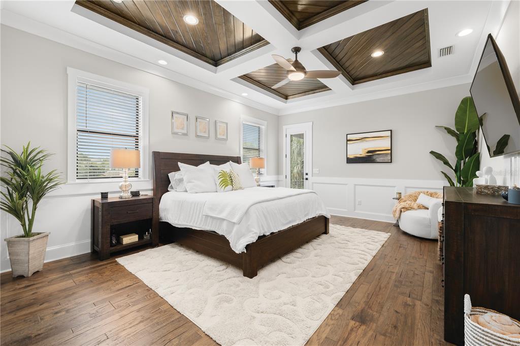 4806 West San Rafael Street Tampa, FL 33629 - Photo 17 of 60 a spacious bedroom with a large bed and a flat screen tv