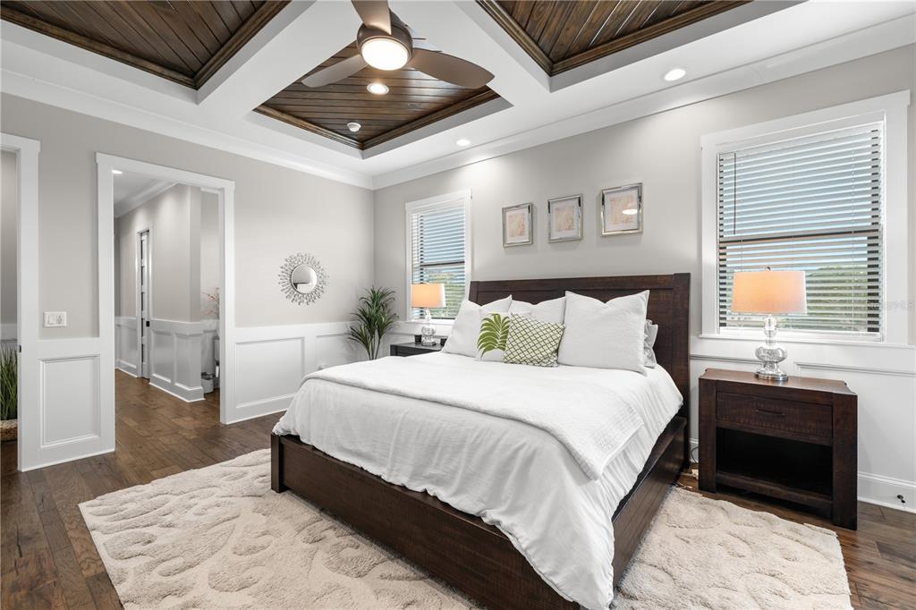 4806 West San Rafael Street Tampa, FL 33629 - Photo 18 of 60 a spacious bedroom with a bed and a dresser next to a window