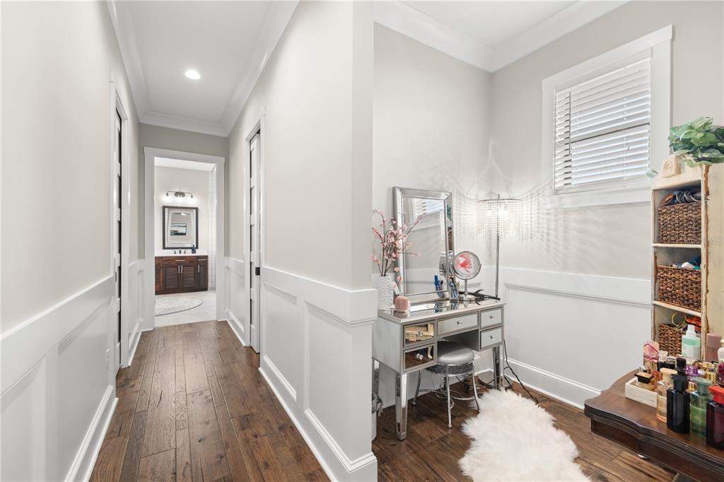 4806 West San Rafael Street Tampa, FL 33629 - Photo 21 of 60 a view of a hallway with workspace and wooden floor