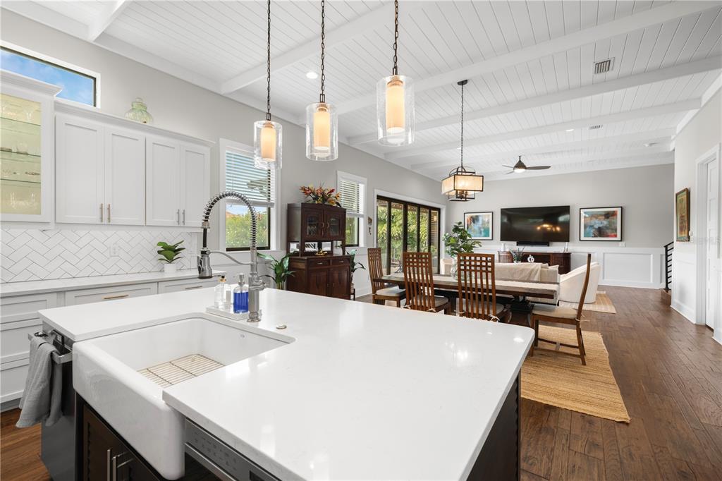 4806 West San Rafael Street Tampa, FL 33629 - Photo 3 of 60 a kitchen with a sink a counter and chairs
