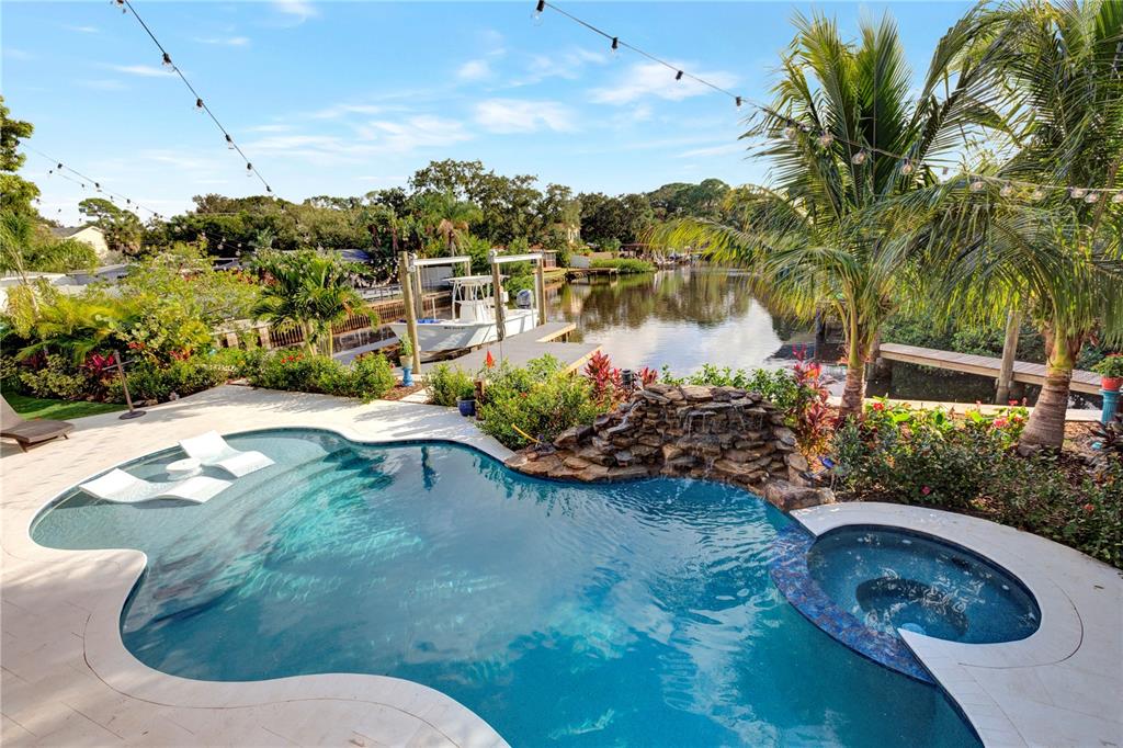 4806 West San Rafael Street Tampa, FL 33629 - Photo 50 of 60 a view of a swimming pool with a yard and sitting area