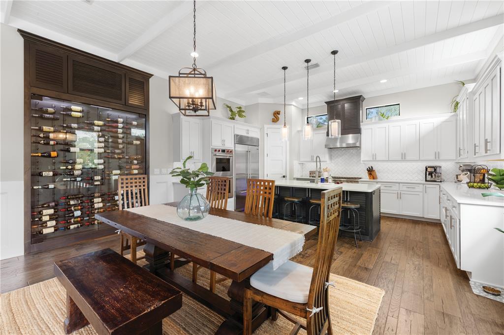 4806 West San Rafael Street Tampa, FL 33629 - Photo 5 of 60 a kitchen with stainless steel appliances granite countertop a stove a kitchen island a dining table and chairs