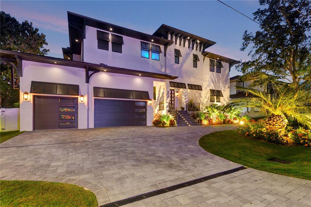 4806 West San Rafael Street Tampa, FL 33629 - Photo 60 of 60 a front view of a house with a yard and garage