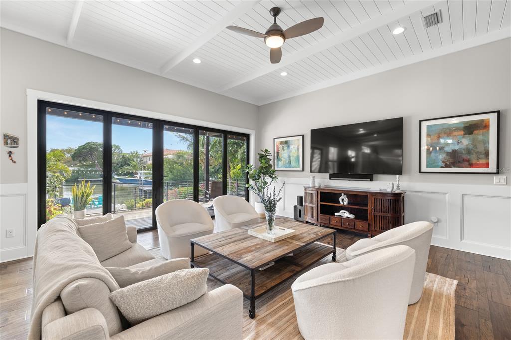 4806 West San Rafael Street Tampa, FL 33629 - Photo 6 of 60 a living room with furniture a flat screen tv and a large window