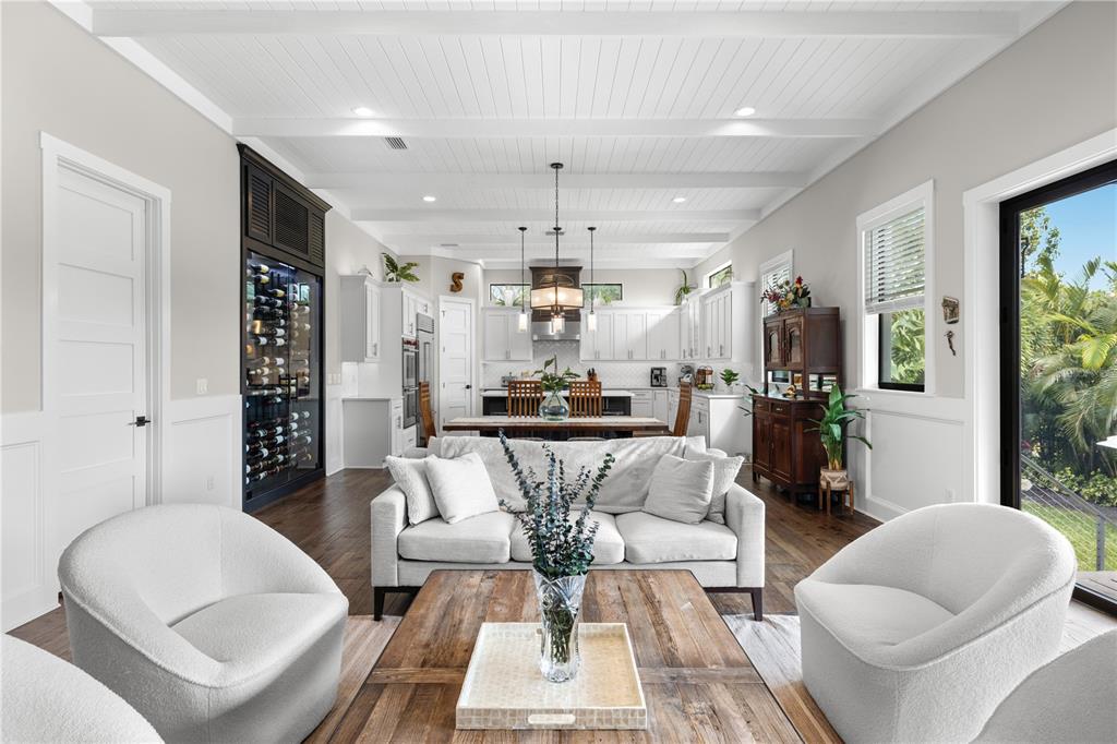 4806 West San Rafael Street Tampa, FL 33629 - Photo 9 of 60 a living room with furniture a chandelier and a dining table