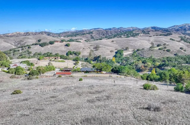 a view of a road with a mountain in the background