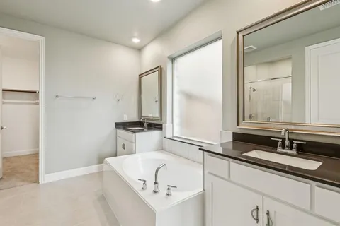 a bathroom with a shower and a sink