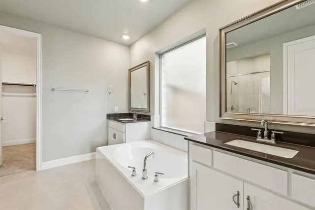 a bathroom with a shower and a sink