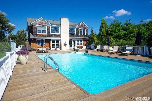 11 Sandys Lane Remsenburg, NY 11960 - Photo 1 of 1 a view of a brick house with a patio