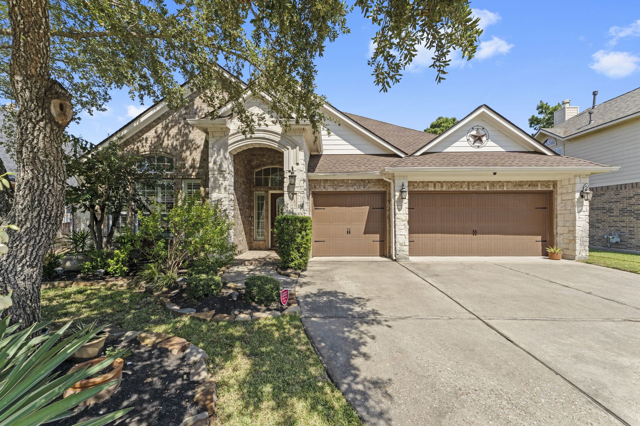 3131 Rustic Gardens Drive Spring, TX 77386 - Photo 1 of 39 a front view of a house with garden