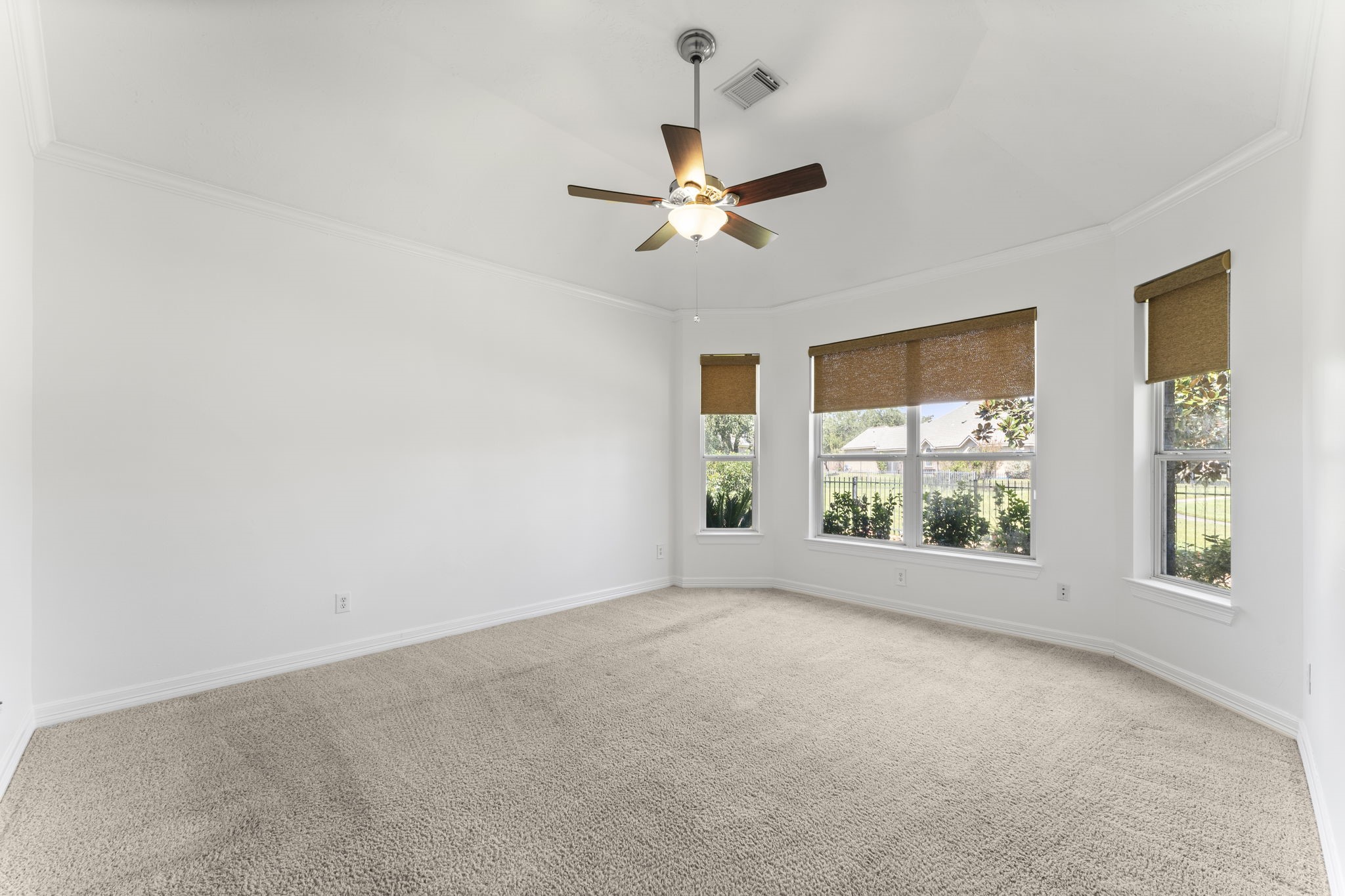 3131 Rustic Gardens Drive Spring, TX 77386 - Photo 11 of 39 a view of a big room with windows and chandelier fan