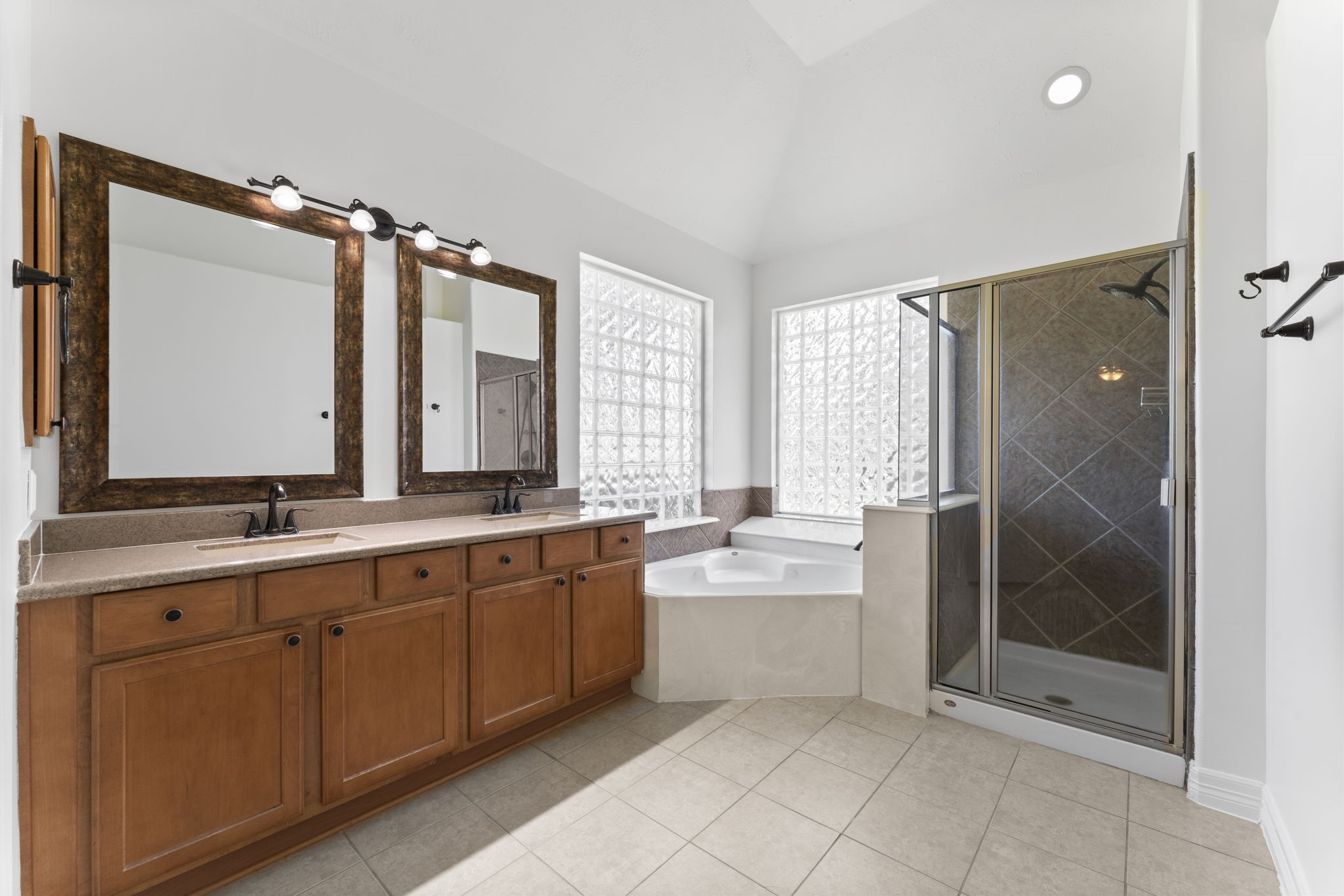 3131 Rustic Gardens Drive Spring, TX 77386 - Photo 13 of 39 a bathroom with a double vanity sink mirror and shower