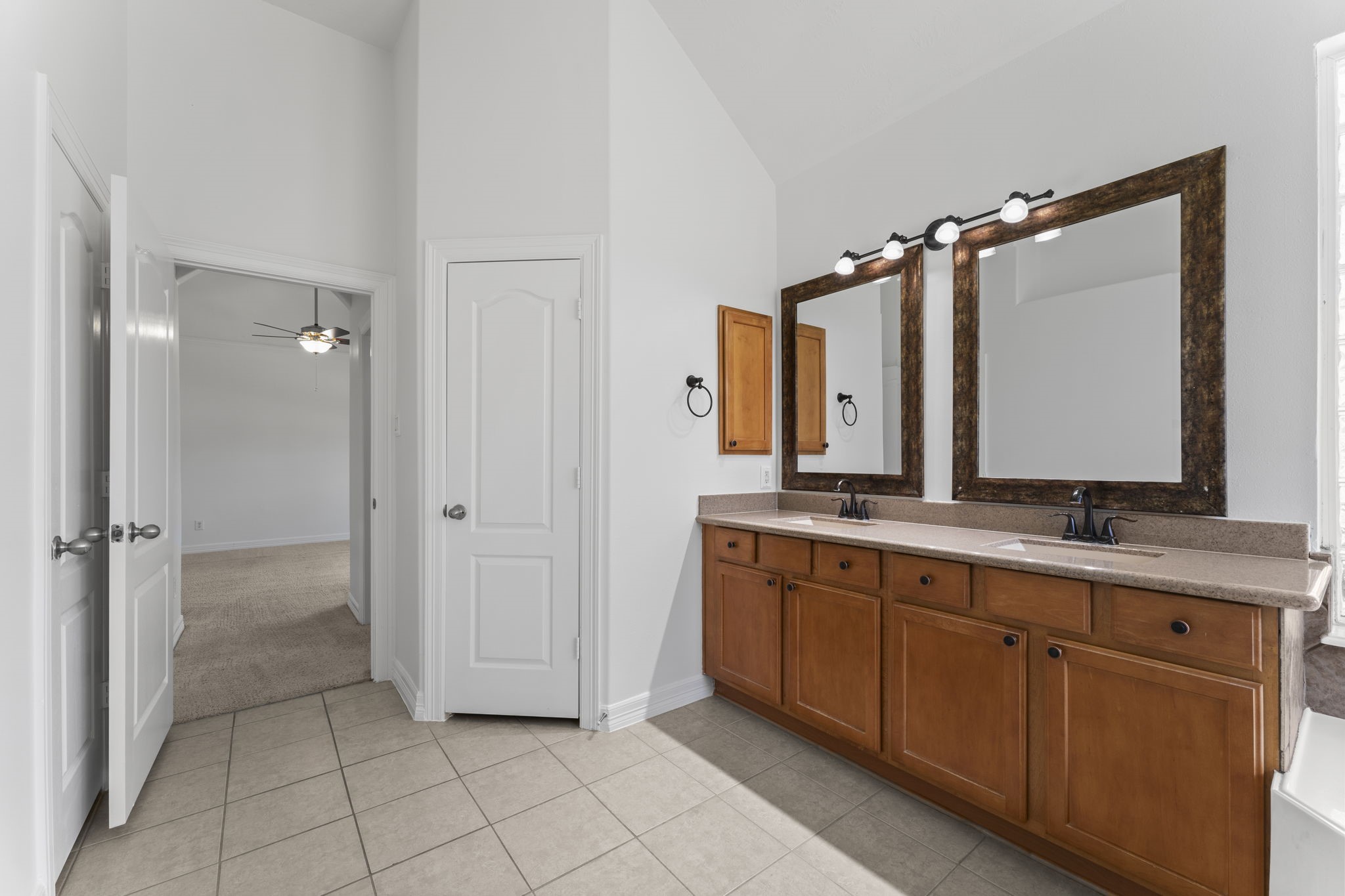 3131 Rustic Gardens Drive Spring, TX 77386 - Photo 14 of 39 a bathroom with a double vanity sink mirror and double