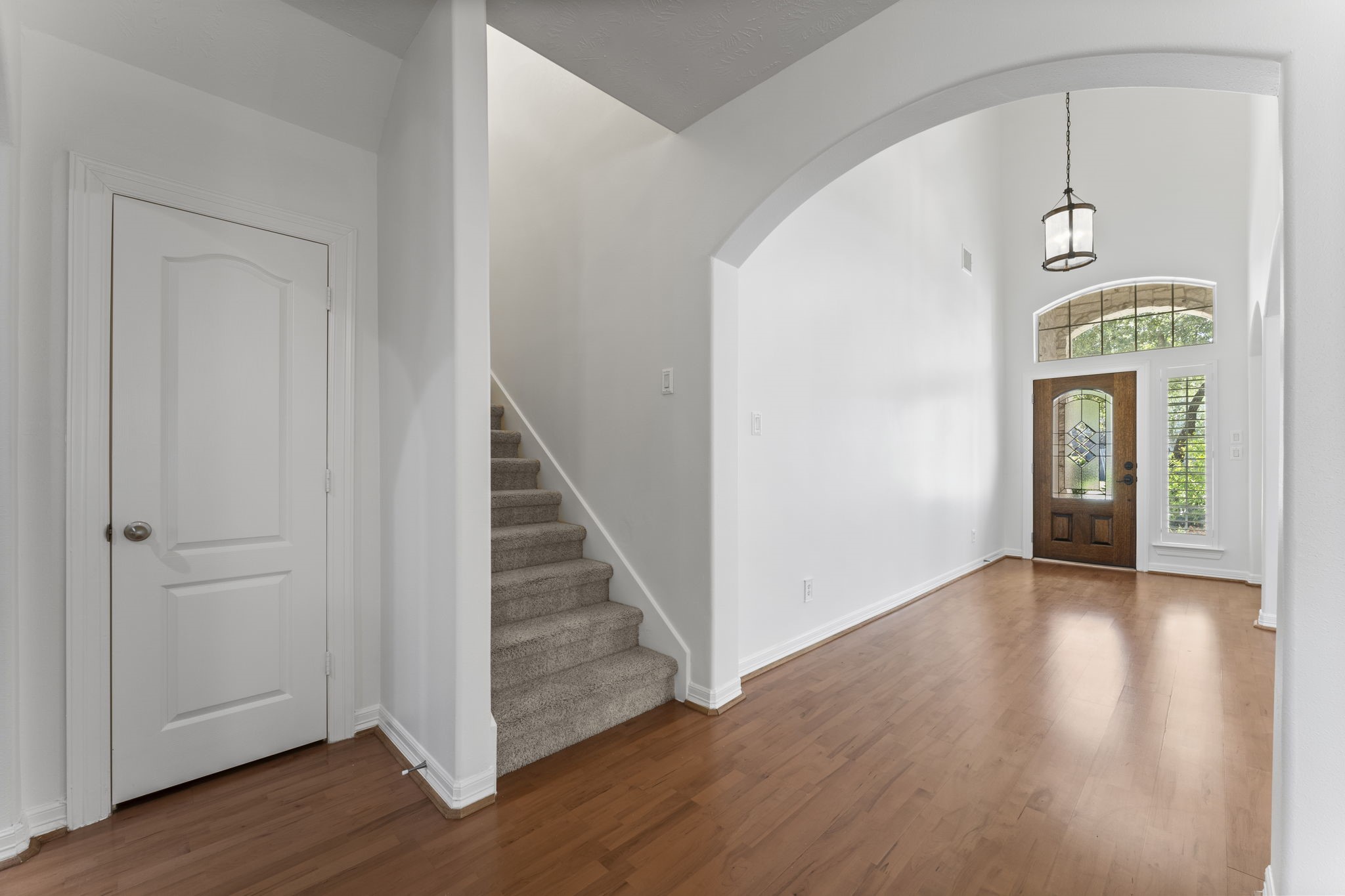 3131 Rustic Gardens Drive Spring, TX 77386 - Photo 17 of 39 an empty room with wooden floor and entryway
