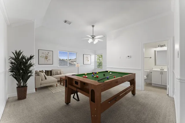 a bedroom with furniture and a chandelier
