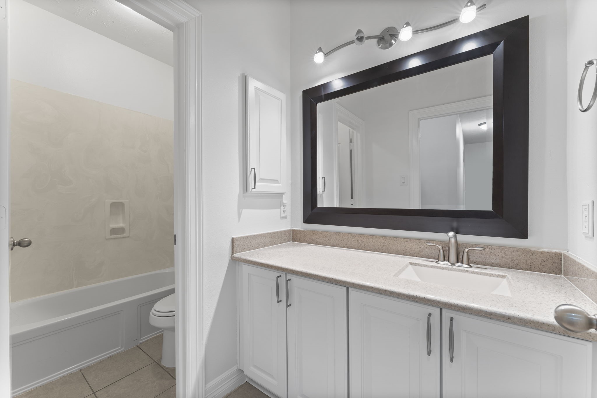 3131 Rustic Gardens Drive Spring, TX 77386 - Photo 25 of 39 a bathroom with a sink and a mirror