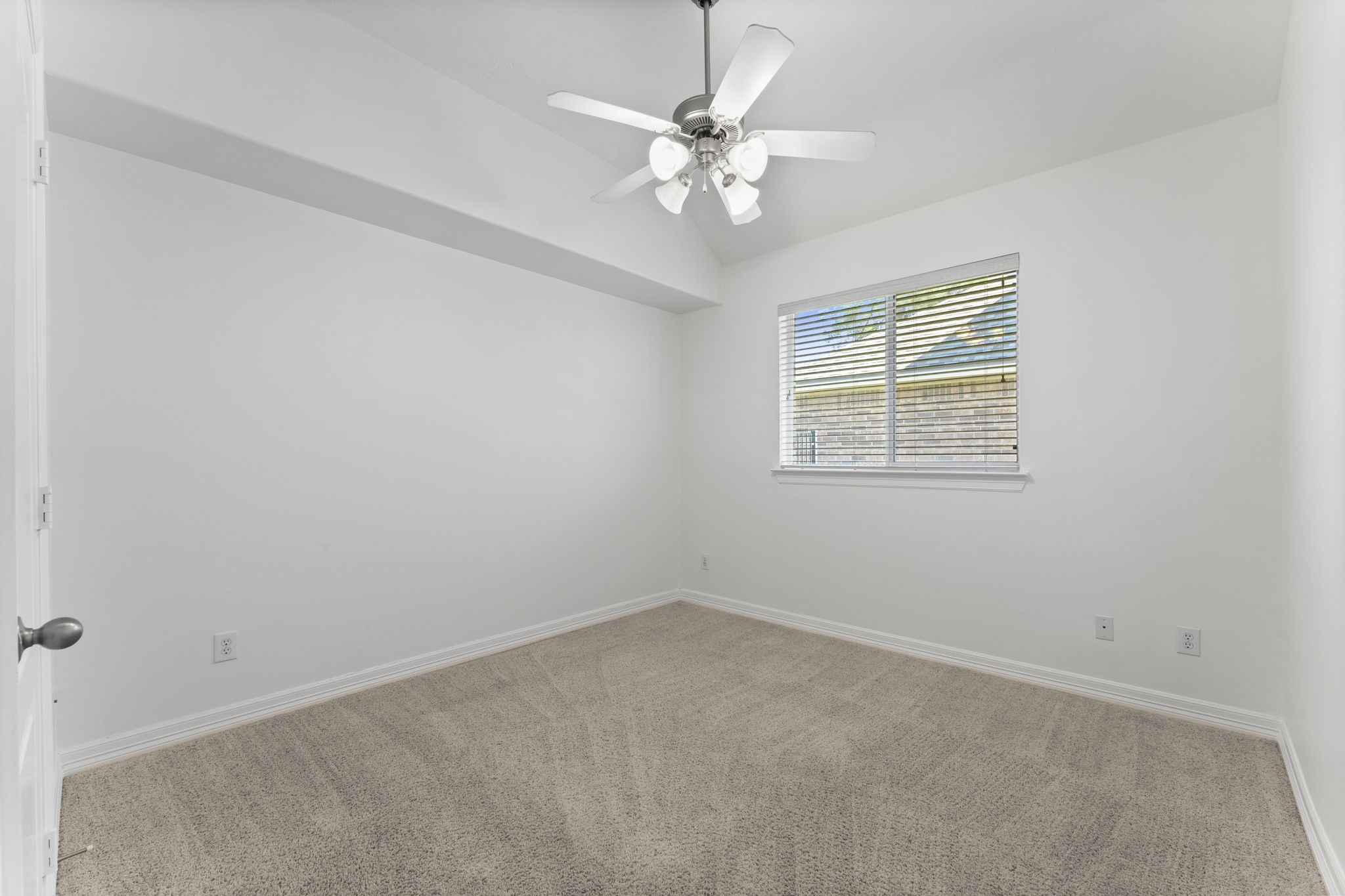 3131 Rustic Gardens Drive Spring, TX 77386 - Photo 28 of 39 an empty room with a window and a fan