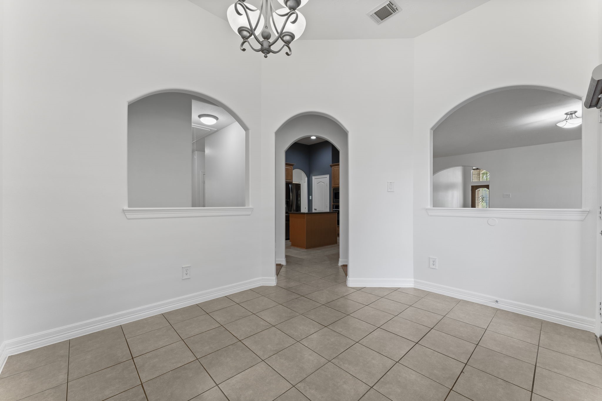 3131 Rustic Gardens Drive Spring, TX 77386 - Photo 29 of 39 an empty room with chandelier