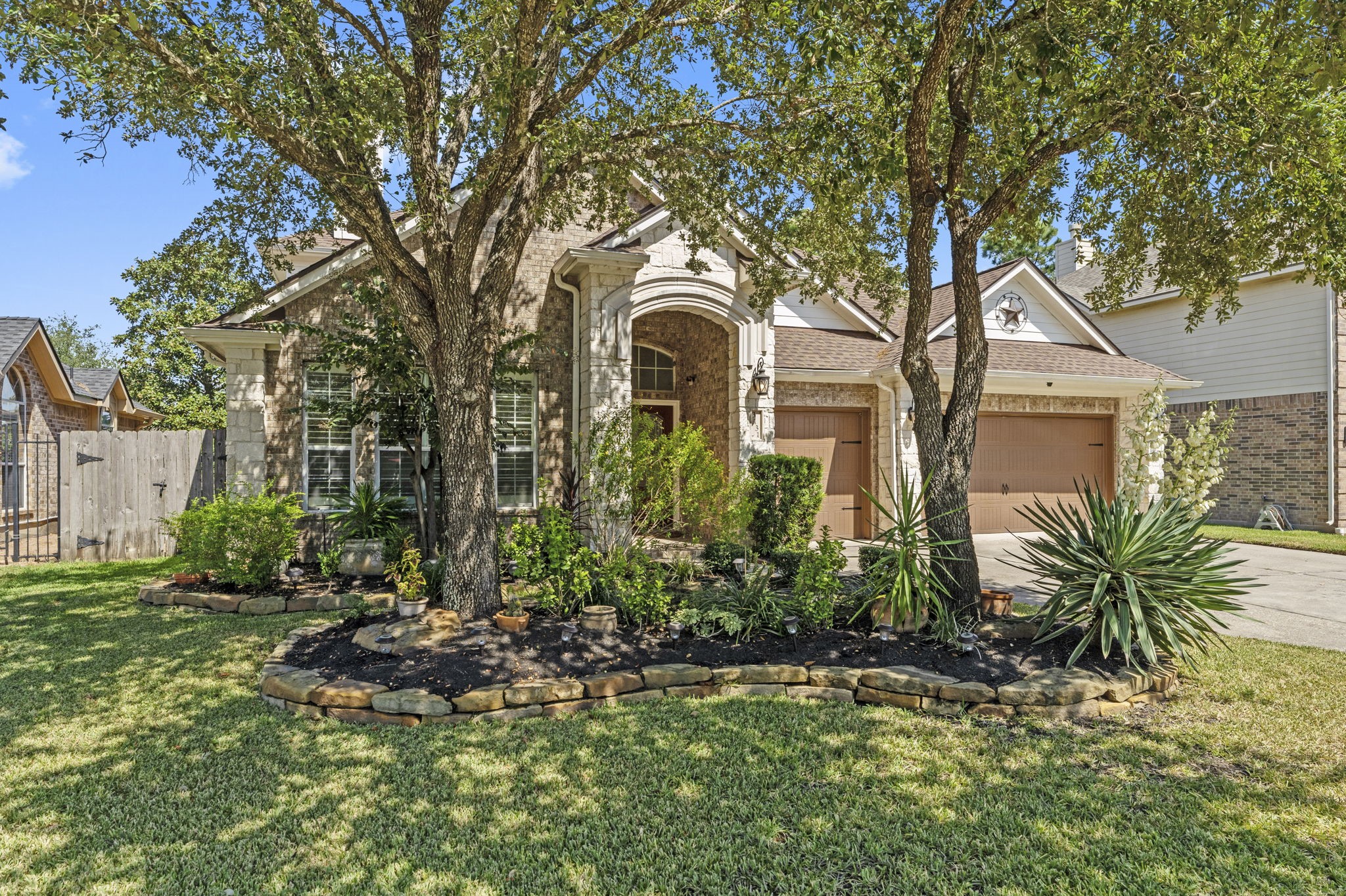 3131 Rustic Gardens Drive Spring, TX 77386 - Photo 3 of 39 a front view of a house with garden