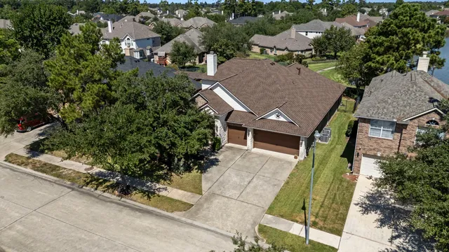 an aerial view of a house with a garden