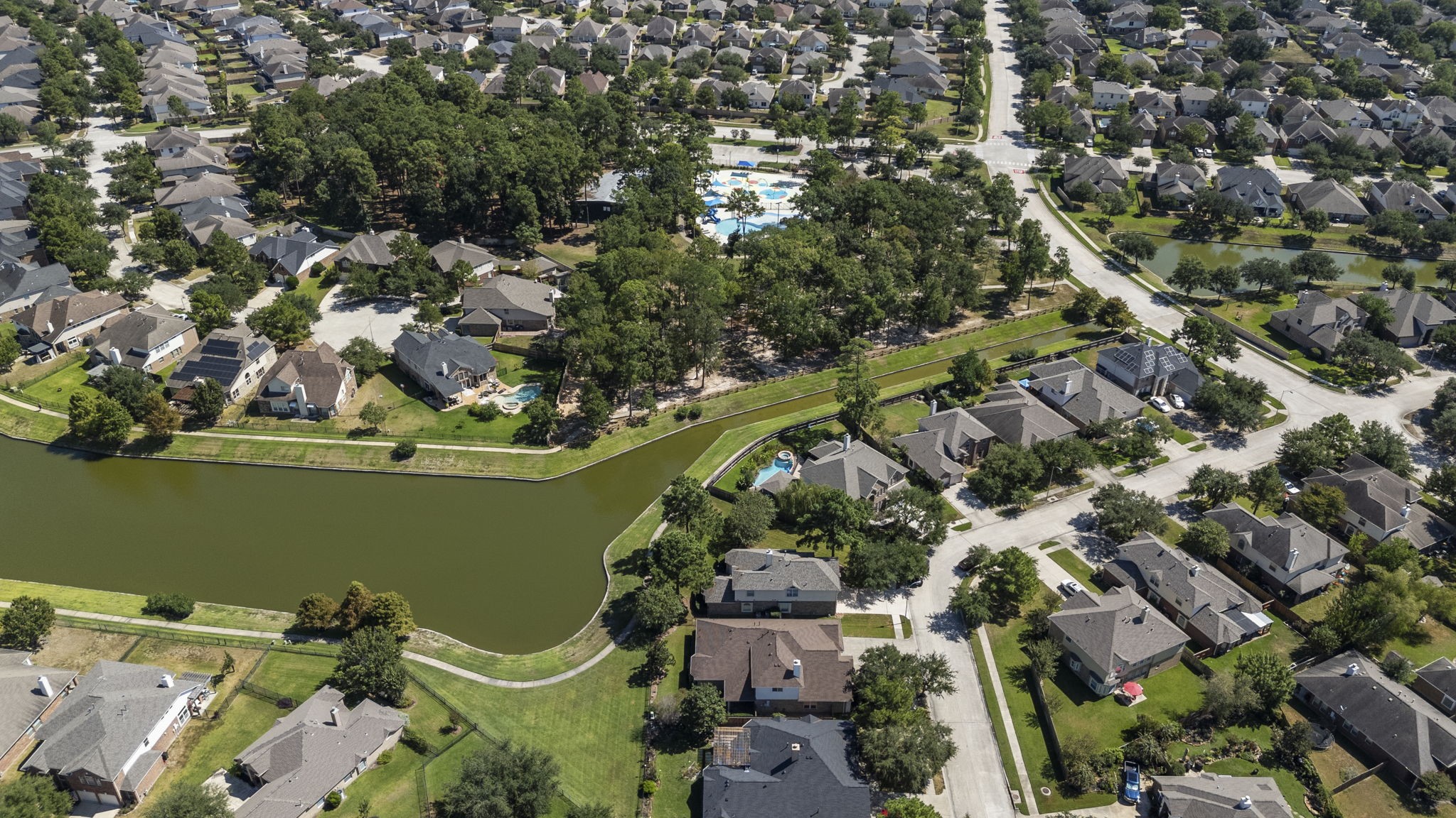 3131 Rustic Gardens Drive Spring, TX 77386 - Photo 34 of 39 an aerial view of a house with a yard and lake view