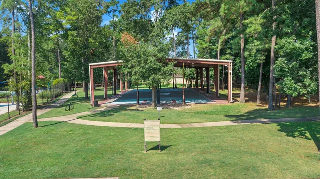 a view of a backyard with swimming pool