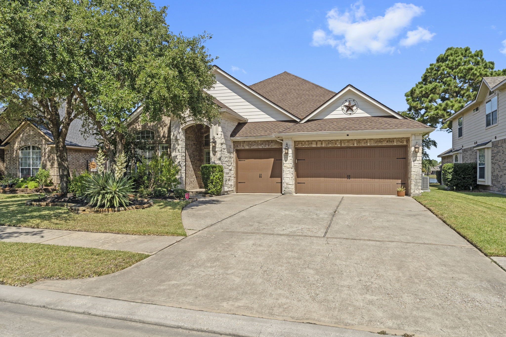 3131 Rustic Gardens Drive Spring, TX 77386 - Photo 39 of 39 front view of a house with a yard and potted plants