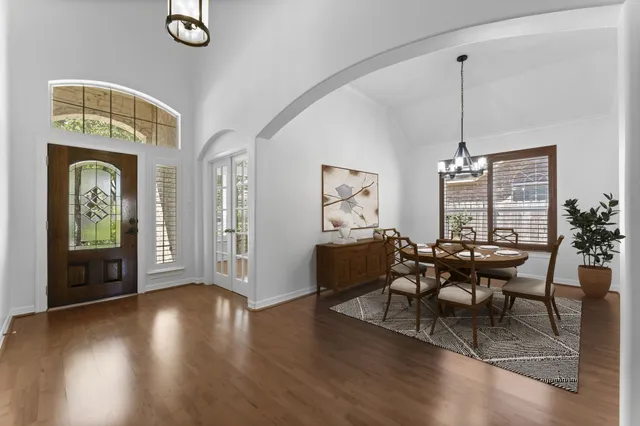 a view of a livingroom with furniture window and wooden floor