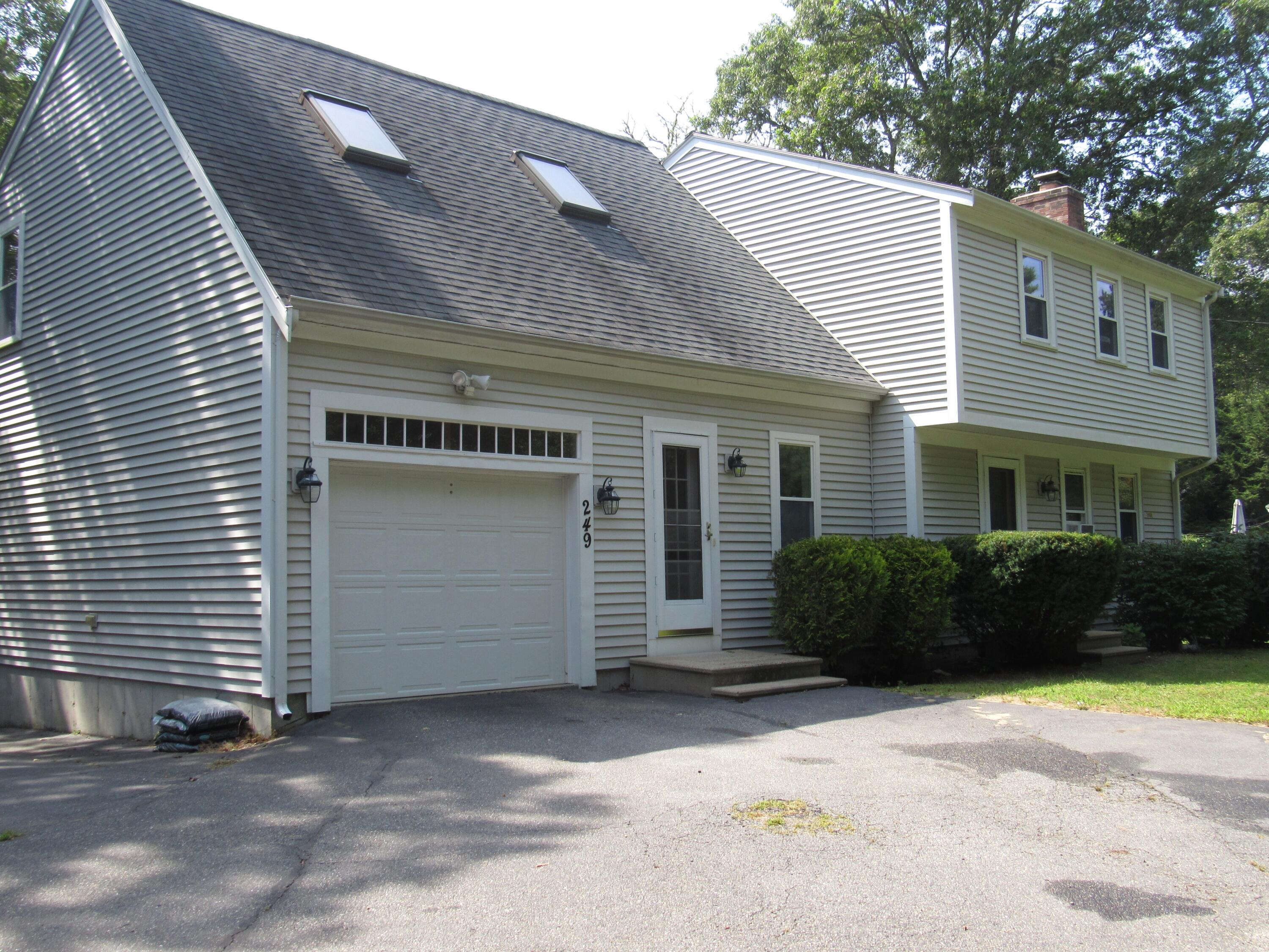 249 Ames Way Centerville, MA 02632 - Photo 1 of 41 a front view of a house with a yard